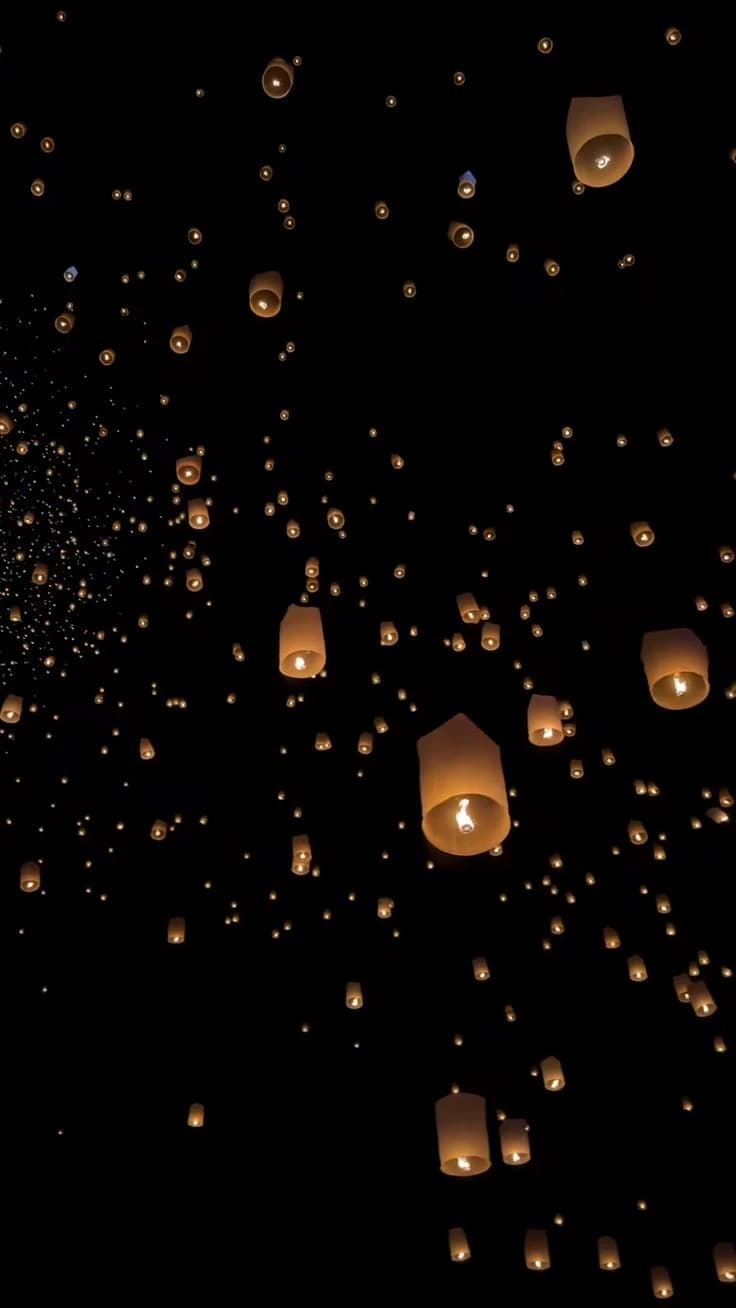 Lanterns rising on a festival night